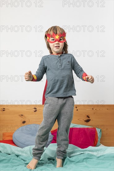 Young boy with costume playing