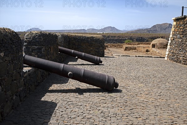 Old cannons and cistern in 16th century fortress Forte Real de Sao Filipe looking over the city Cidade Velha on the island Santiago