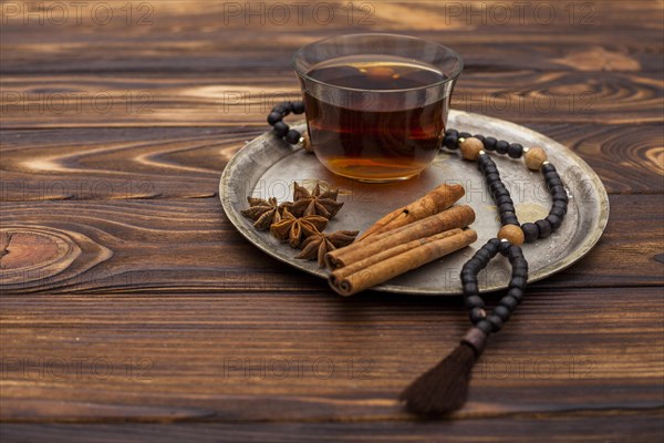 Tea cup with cinnamon rosary beads plate