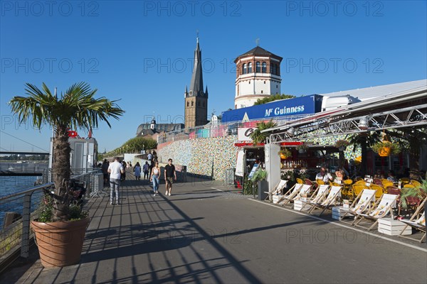 Rhine promenade with St Lambert's Basilica and castle tower