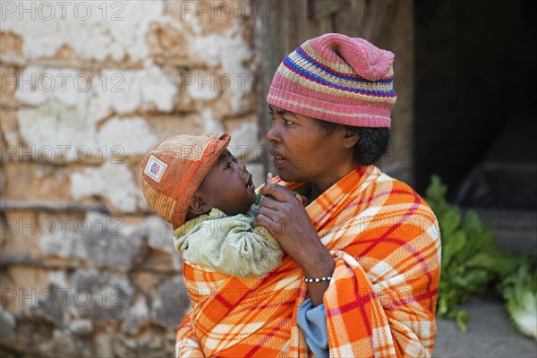 Mother and child dressed in the traditional blanket coat of the Betsileo tribe