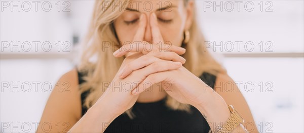 Close up young businesswoman with hands face