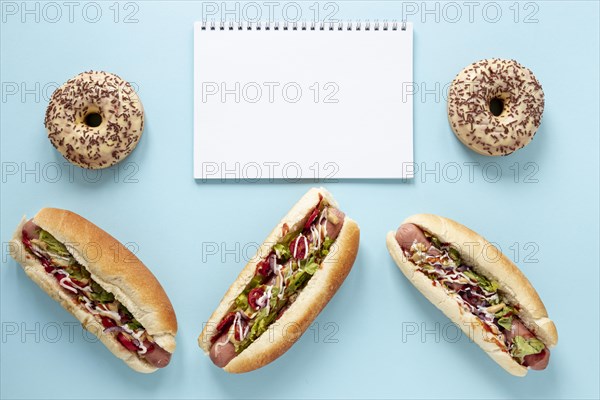 View assortment with hot dogs blue background