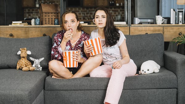 Young women watching television