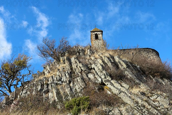 View from below of Brionnet chapel around Saurier village on volcanic peak