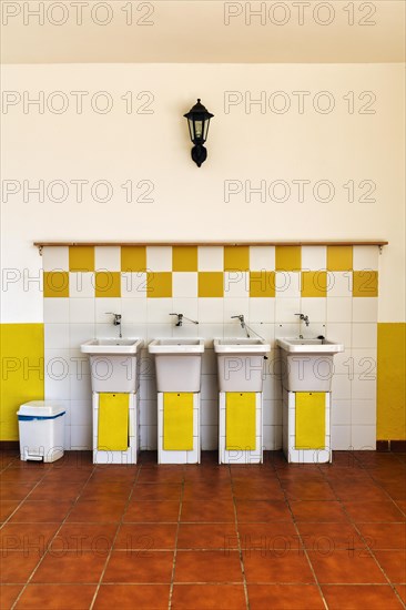 Four old washbasins next to each other