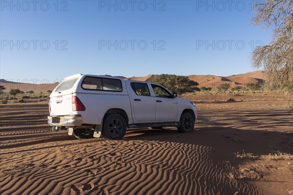 Off-road vehicle in the dunes of Sossusvlei