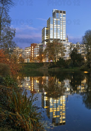 The LVA main building reflected in the Kaiserteich in autumn in the evening