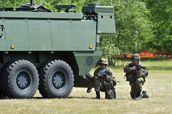 Demonstration of infantry soldiers fighting near MOWAG Piranha IIIC armoured fighting vehicle during open day of the Belgian army at Leopoldsburg