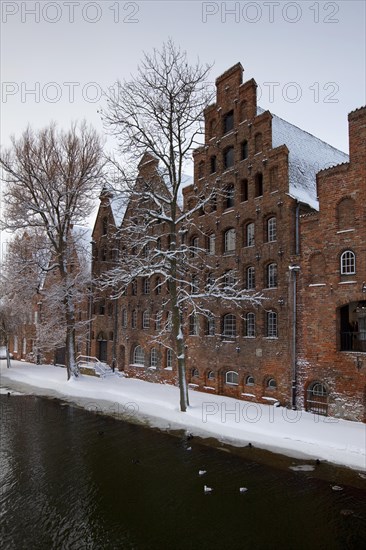 Historic salt warehouses in the snow in winter