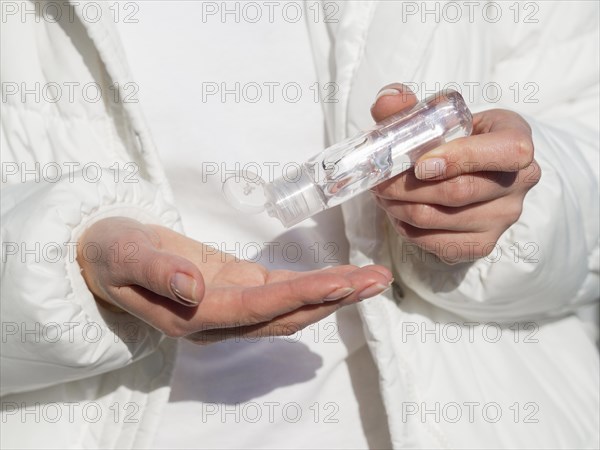 Person using hand sanitizer