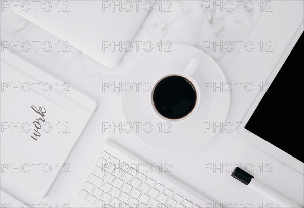 Work text diary digital tablet coffee cup keyboard black marker white desk