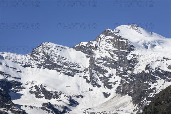 Snow covered mountain Gran Paradiso seen from Cogne in the Graian Alps