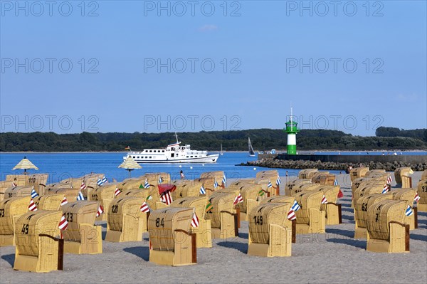 Roofed wicker beach chairs on the beach at Travemuende