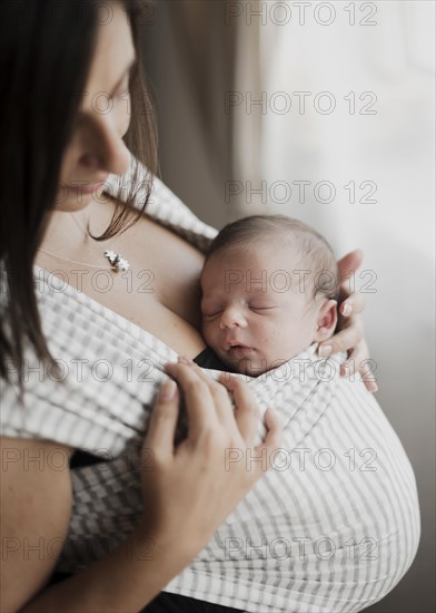 Portrait mother holding her little kid