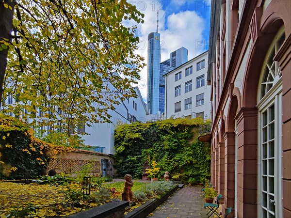 View of the garden of the Goethe House with Commerzbank Tower