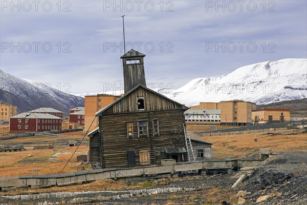 Derelict wooden building with tower at Pyramiden