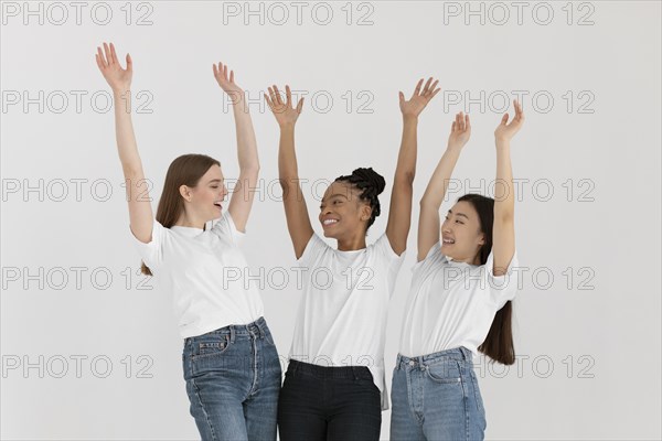 Medium shot women with hands up