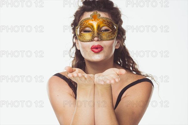 Woman golden mask posing