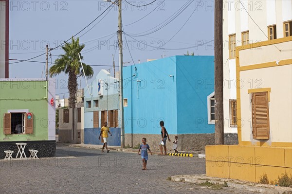 Street with colourful houses at the fishing village Palmeira on the island of Sal