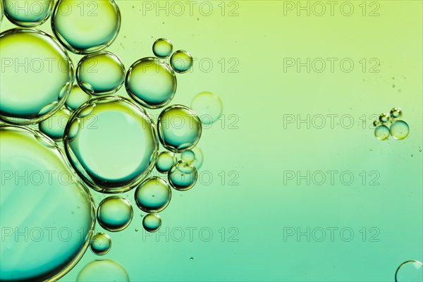 Oil drops water surface abstract background