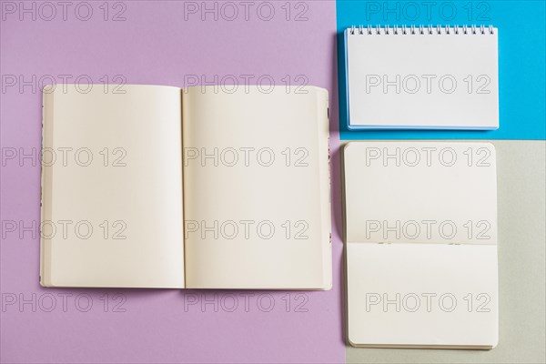 Overhead view spiral books multicolored background