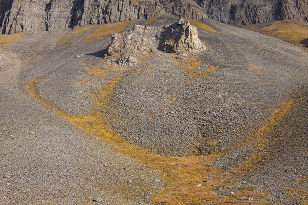 Scree below eroded rock formations at Adventdalen