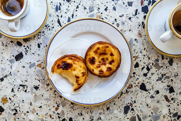 Delicious portuguese pastry named pastel de Belem or pastel de nata typically eaten with expresso coffee