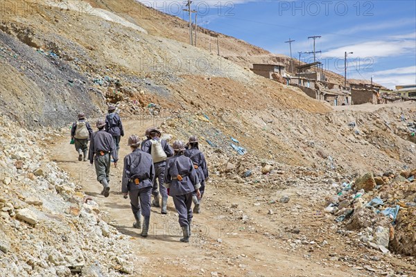 Tourists with guide visiting silver mine on the Cerro Rico de Potosi