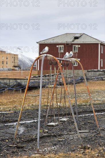 Old swing on children's playground at Pyramiden