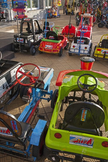 Go-carts on sea dyke promenade along the North Sea coast