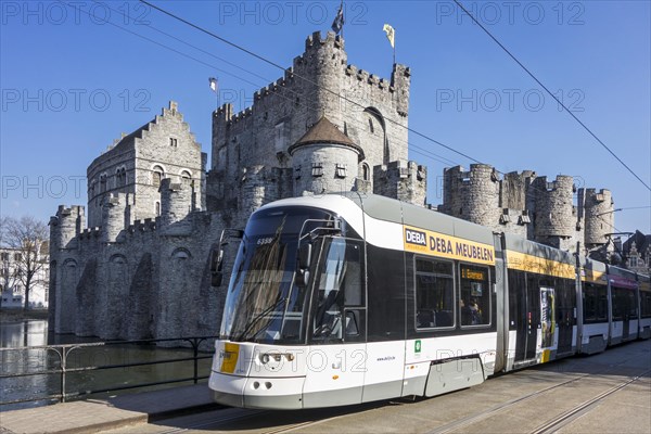 Tram of De Lijn in front of medieval Gravensteen