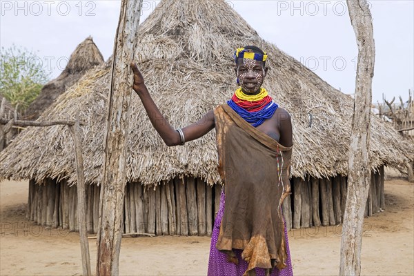 Black woman with painted face of the Karo