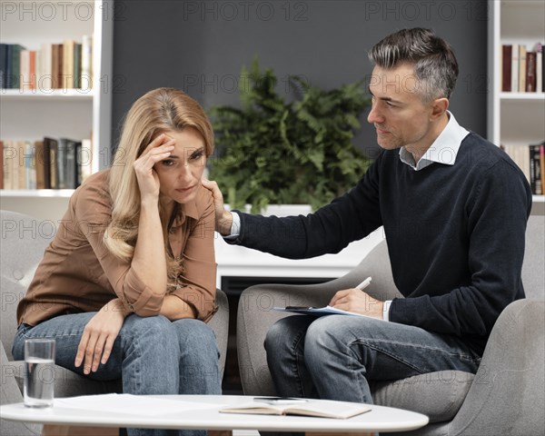 Mid shot counselor comforting patient