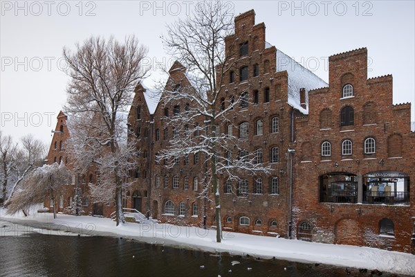 Historic salt warehouses in the snow in winter
