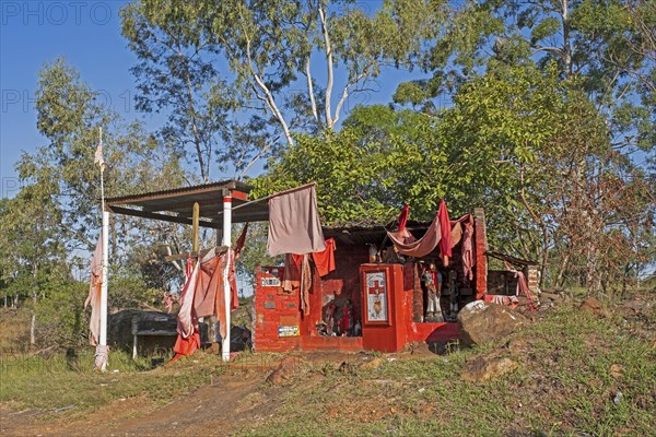 Traditional red roadside shrine to folk saint Gauchito Gil