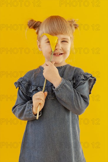 Happy girl holding calla lily flower