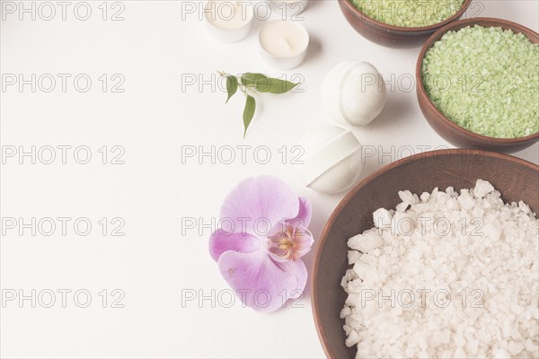 White green spa bath salt bowl with spa bomb orchid white backdrop