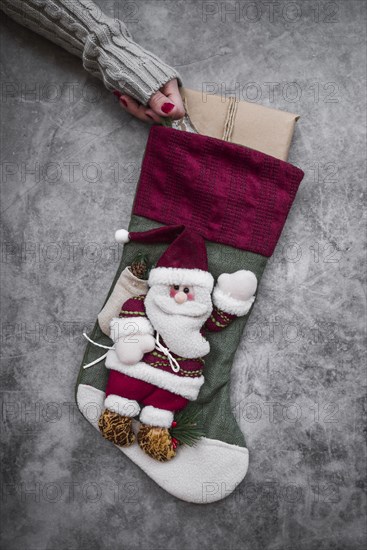 Woman holding big christmas sock