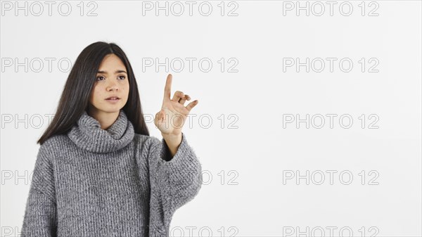 Woman with forefinger raised