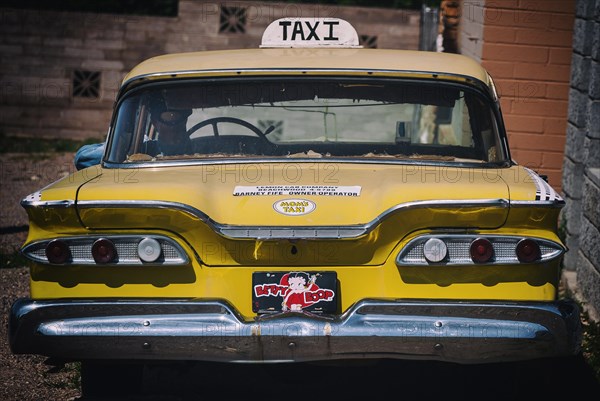 Old discarded Cadillac as a taxi