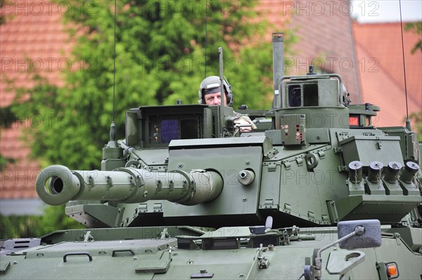 Commander in turret of MOWAG Piranha IIIC armoured fighting vehicle of the Belgian army