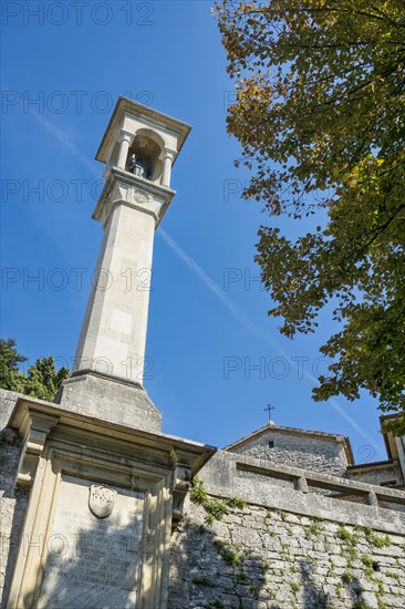 Monument to St Francis in front of the church of San Quirino