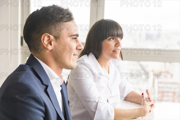 Portrait smiling young business couple office