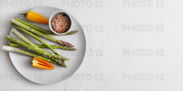 Top view asparagus plate with himalayan salt copy space