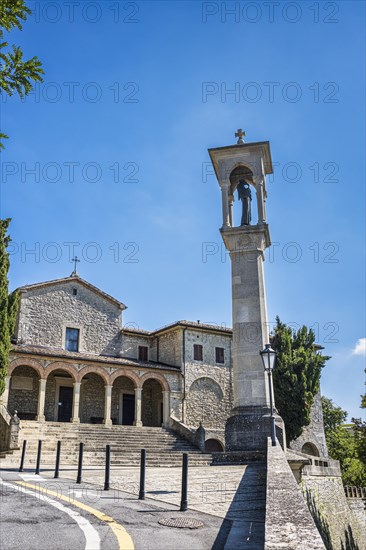 Monument to St Francis in front of the church of San Quirino