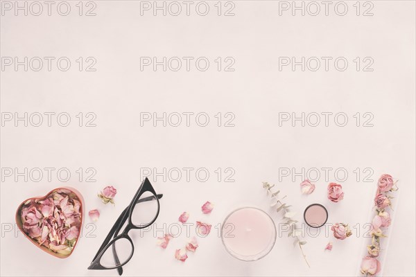 Rose petals with glasses candle table