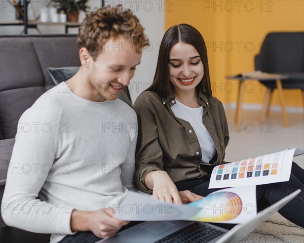 Smiley couple planning redecorate house
