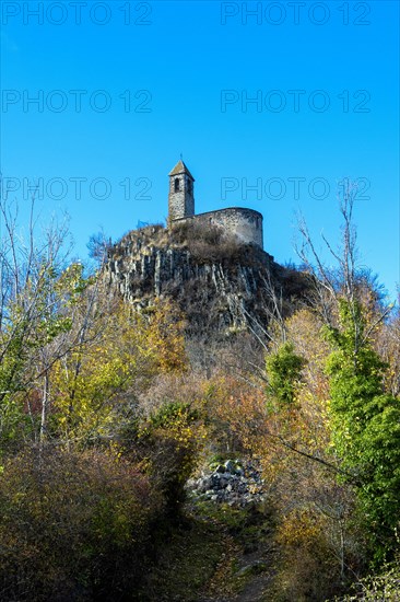 View from below of Brionnet chapel around Saurier village on volcanic peak