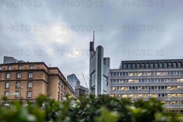 Sunset between skyscrapers. Cityscape with modern office buildings and streets. Insurance companies and banks as a cityscape in Frankfurt am Main